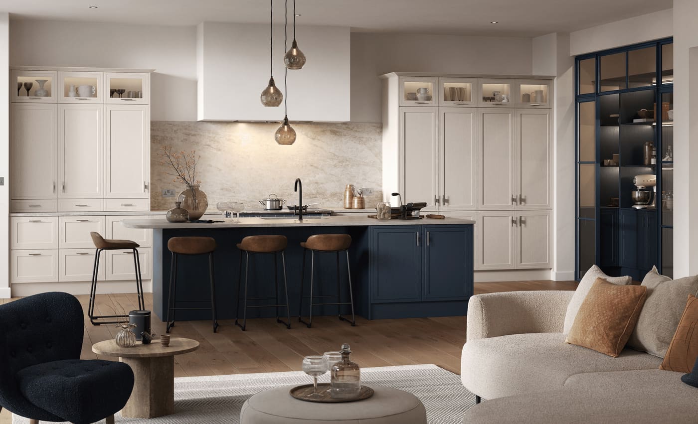 A warm open-plan Emily Evan kitchen in cream and midnight blue, with pendant lighting over the island
