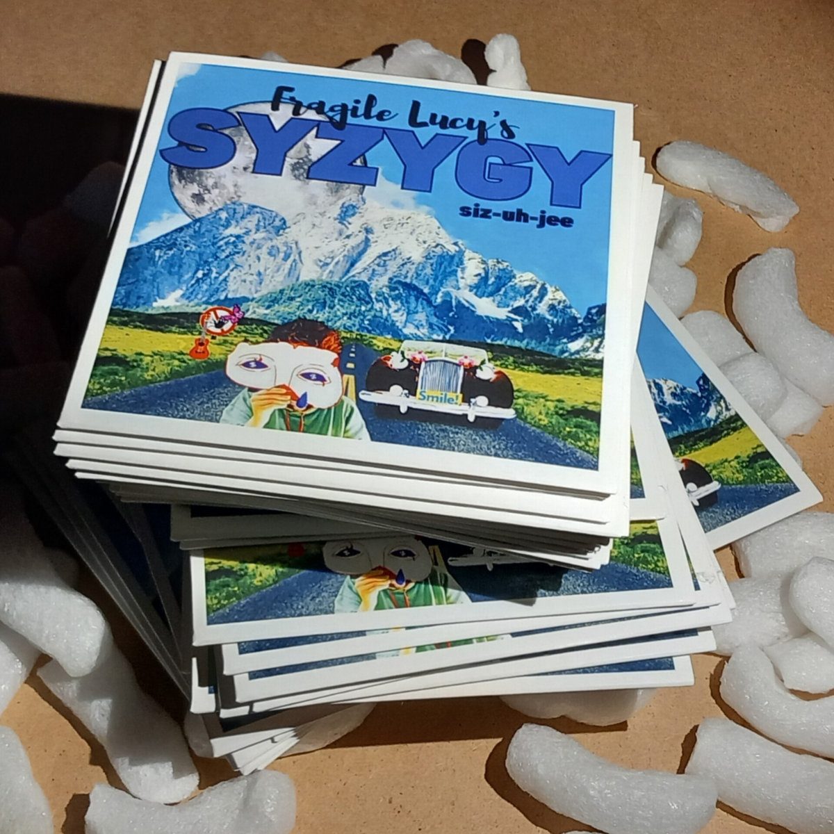 A stack of SYZYGY CDs