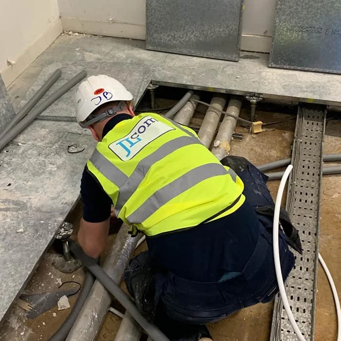 JLcom engineer installing pipework