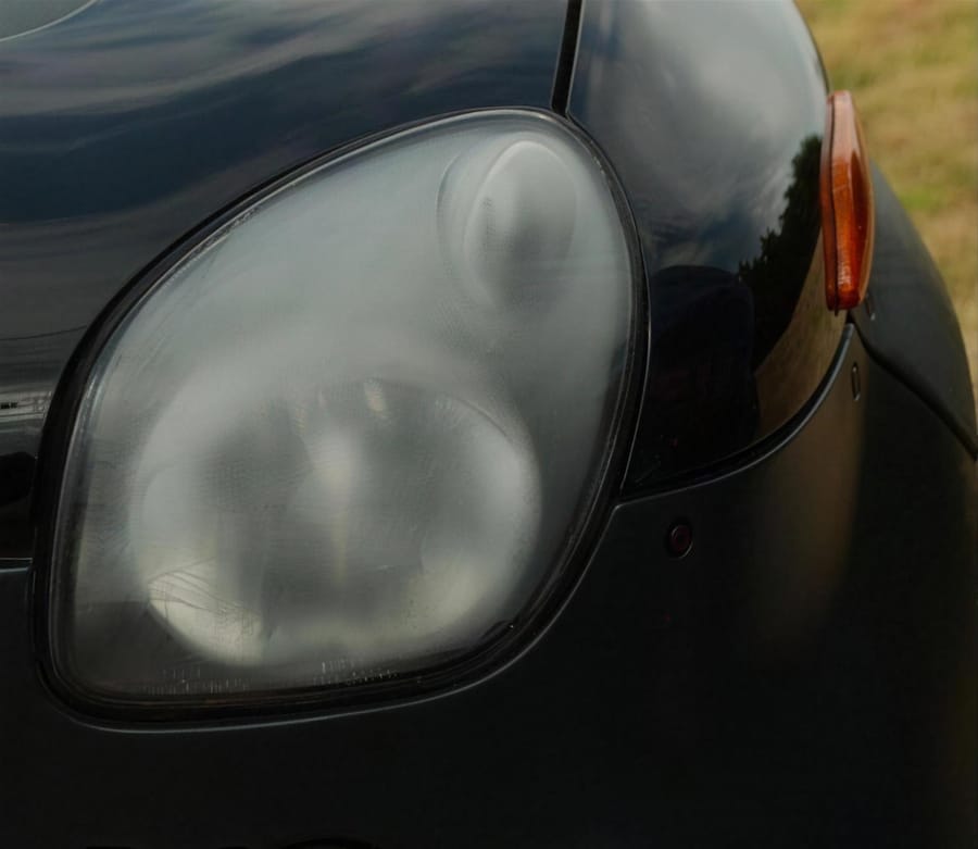 A dull, oxidised headlight before restoration